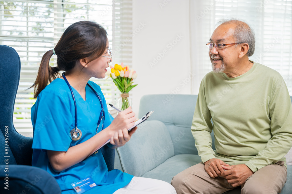Obraz premium Asian young nurse writing prescription during home visit sick elder old man, Senior man takes doctor at home telling about health complaints, health care and medical concept