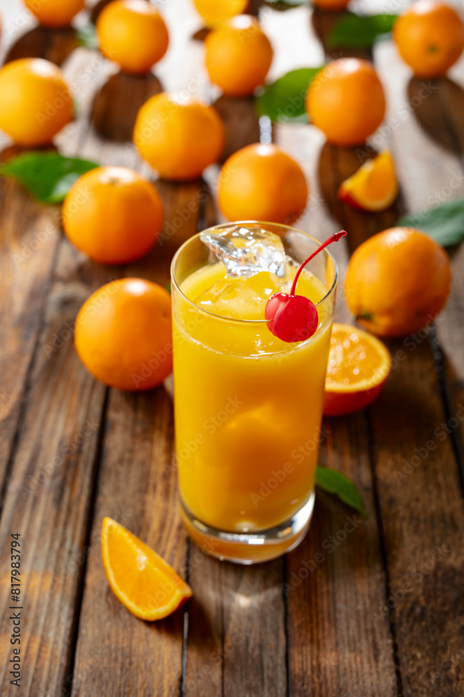 Orange juice and fresh fruits on an old wooden table. Orange juice and fresh fruits on an old wooden table.