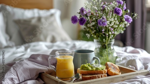 Wooden tray with homemade toast, fresh fruit, coffee cup for healthy breakfast in modern bedroom, flowers in vase, elevated luxurious morning routine, selfcare everyday ritual. AI generated image © Maria Zamchiy 