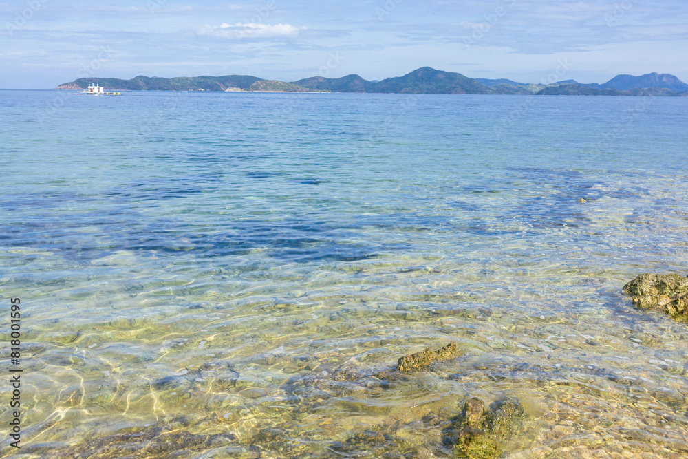 the tranquil shoreline of Coron in Palawan region of the Philippines the tranquil shoreline of Coron in Palawan region of the Philippines