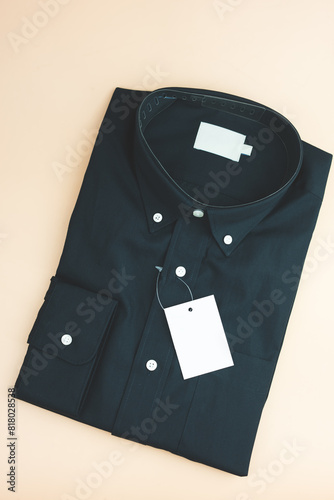 Close up new black shirt with empty price tag