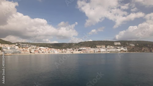 Wallpaper Mural Panorama showing view of Sesimbra Town and Port timelapse, Portugal. Skyline landscape with boats, houses and beach from lighthouse on a pier. Resort in Setubal district. Beautiful clouds Torontodigital.ca