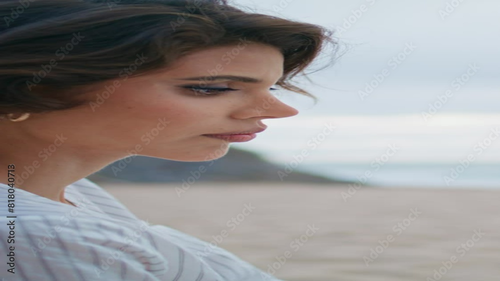 Beautiful woman reading beach on rocky island vertical closeup. Calm girl relax