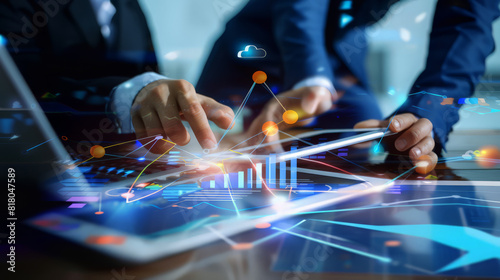 Business team using digital tablet and laptop analyzing sales data, economic growth graph chart. Business planning and strategy. Financial report, market research