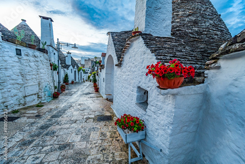 Trulli of Alberobello, Puglia, Italy. town of Alberobello with trulli houses among green plants and flowers