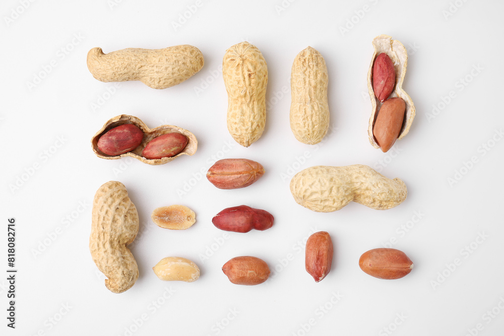 Fresh peanuts on white table, flat lay Fresh peanuts on white table, flat lay