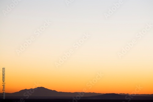 Sunset Sky Over Silhouetted Mountains