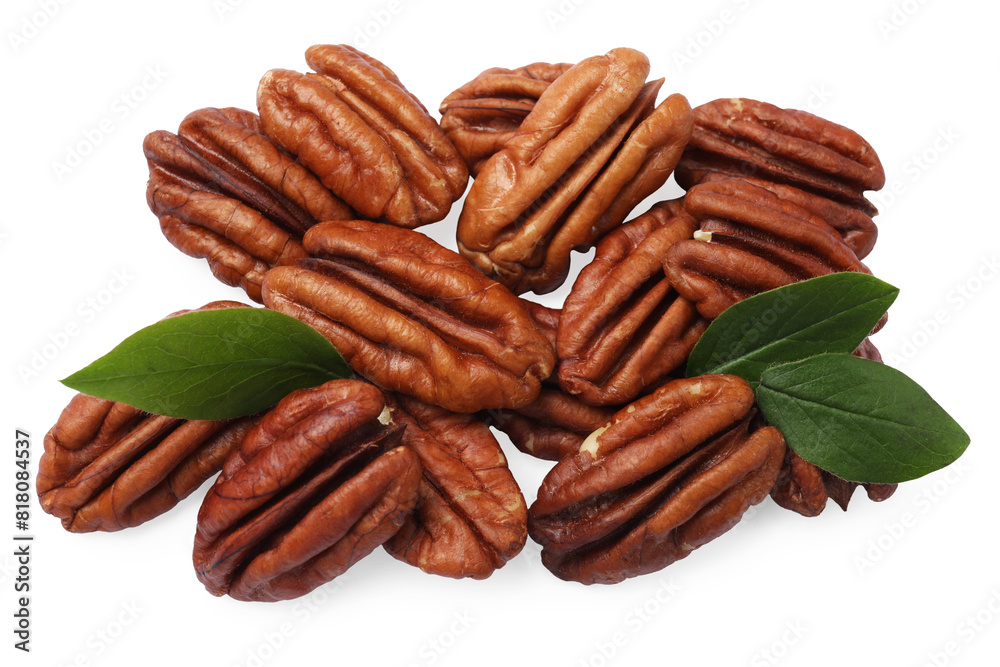 Many tasty pecan nuts with green leaves isolated on white, top view Many tasty pecan nuts with green leaves isolated on white, top view