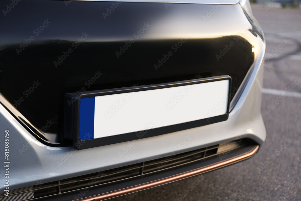 Vehicle registration plate on car outdoors, closeup