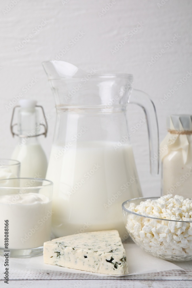 Different fresh dairy products on white wooden table Different fresh dairy products on white wooden table