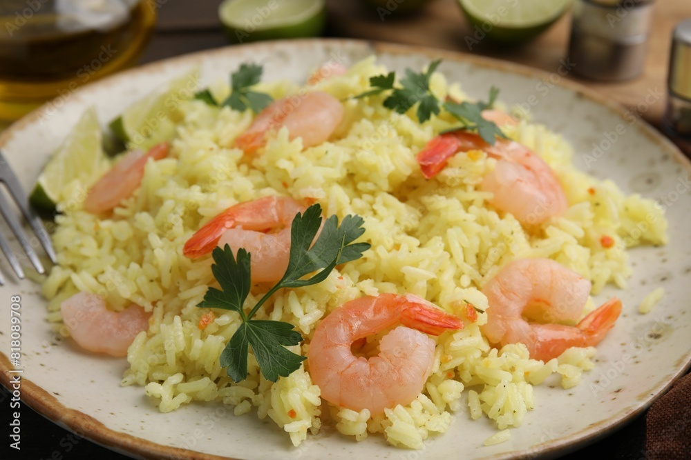 Delicious risotto with shrimps and parsley on table, closeup Delicious risotto with shrimps and parsley on table, closeup