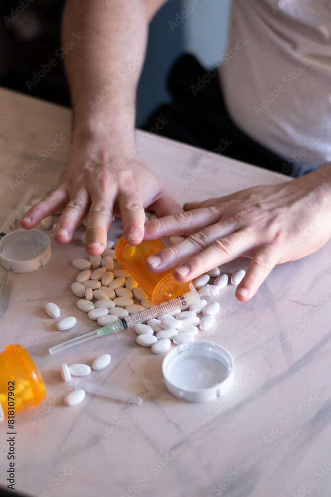 Sadness and addicted person with many drugs and vacum front her on the table Sadness and addicted person with many drugs and vacum front her on the table