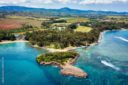 Aerial panoramic of waves of Indian Ocean and turquoise coral reef, Poste Lafayette, East coast, Mauritius. Turquoise coral reef meeting the waves of the Indian Ocean, Poste Lafayette, Mauritius.