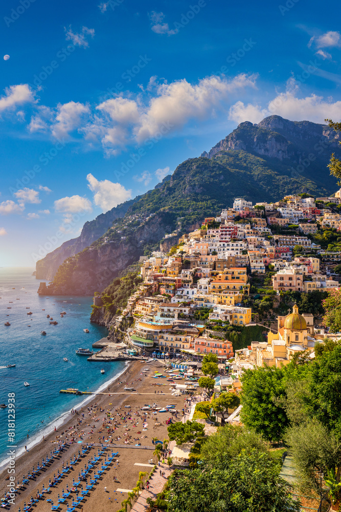 Naklejka premium View of Positano with comfortable beach and blue sea on Amalfi Coast in Campania, Italy. Positano village on the Amalfi Coast, Salerno, Campania. Beautiful Positano, Amalfi Coast in Campania.