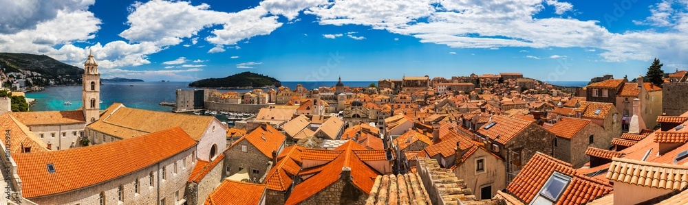 Dubrovnik a city in southern Croatia fronting the Adriatic Sea, Europe. Old city center of famous town Dubrovnik, Croatia. Picturesque view on Dubrovnik old town (medieval Ragusa) and Dalmatian Coast. Dubrovnik a city in southern Croatia fronting the Adriatic Sea, Europe. Old city center of famous town Dubrovnik, Croatia. Picturesque view on Dubrovnik old town (medieval Ragusa) and Dalmatian Coast.