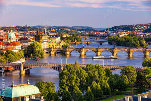 Scenic view of the Old Town pier architecture and Charles Bridge over Vltava river in Prague, Czech Republic. Prague iconic Charles Bridge (Karluv Most) and Old Town Bridge Tower at sunset, Czechia. photo