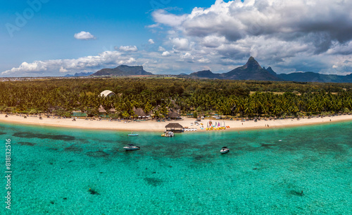 Beautiful Mauritius Island with gorgeous beach Flic en Flac, aerial view from drone. Mauritius, Black River, Flic-en-Flac view of oceanside village beach and luxurious hotel in summer.