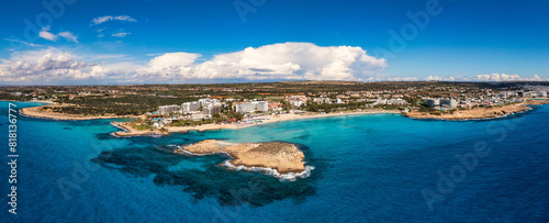 Aerial view of beautiful Nissi beach in Ayia Napa, Cyprus. Nissi beach in Ayia Napa famous tourist beach in Cyprus. A view of a azzure water and Nissi beach in Aiya Napa, Cyprus. photo