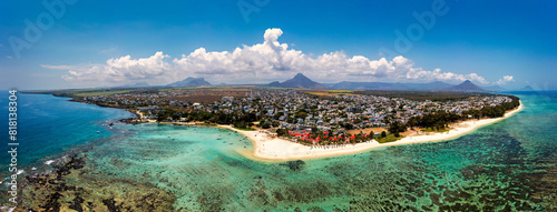 Beautiful Mauritius Island with gorgeous beach Flic en Flac, aerial view from drone. Mauritius, Black River, Flic-en-Flac view of oceanside village beach and luxurious hotel in summer. photo