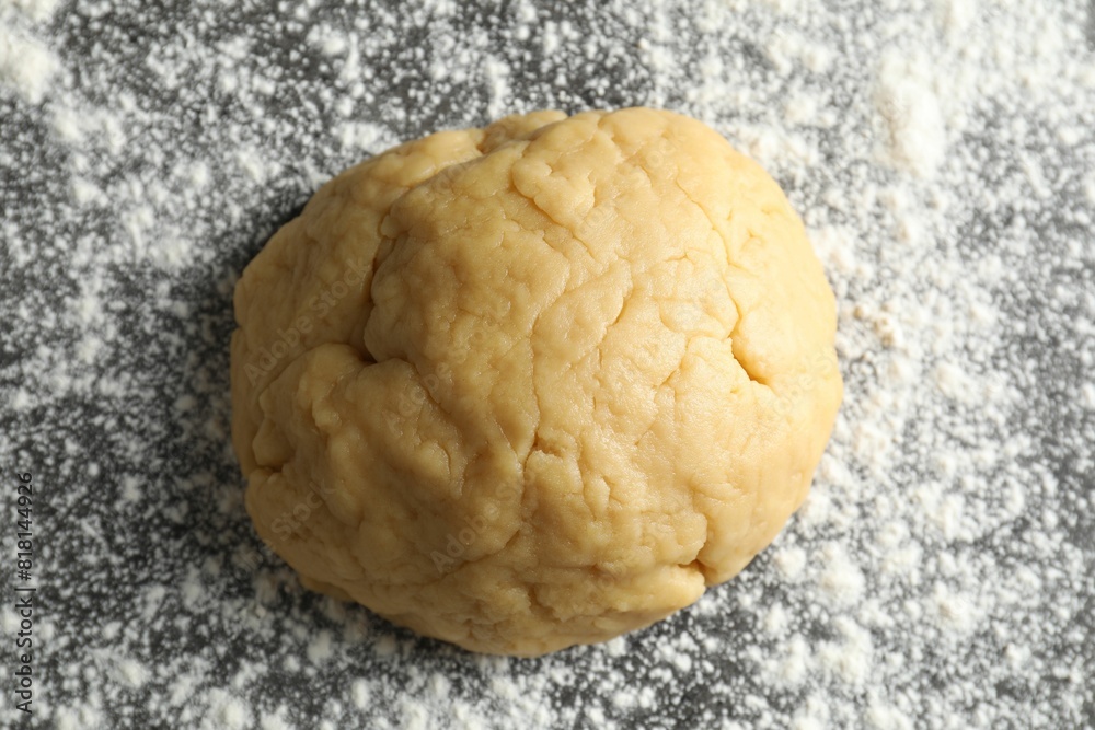 Making shortcrust pastry. Raw dough and flour on table, top view Making shortcrust pastry. Raw dough and flour on table, top view