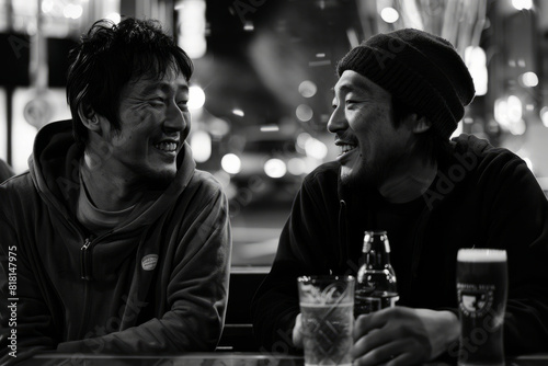 Two Japanese pals bonding over beers and engaging in conversation, illustrating the essence of male friendship and bromance.