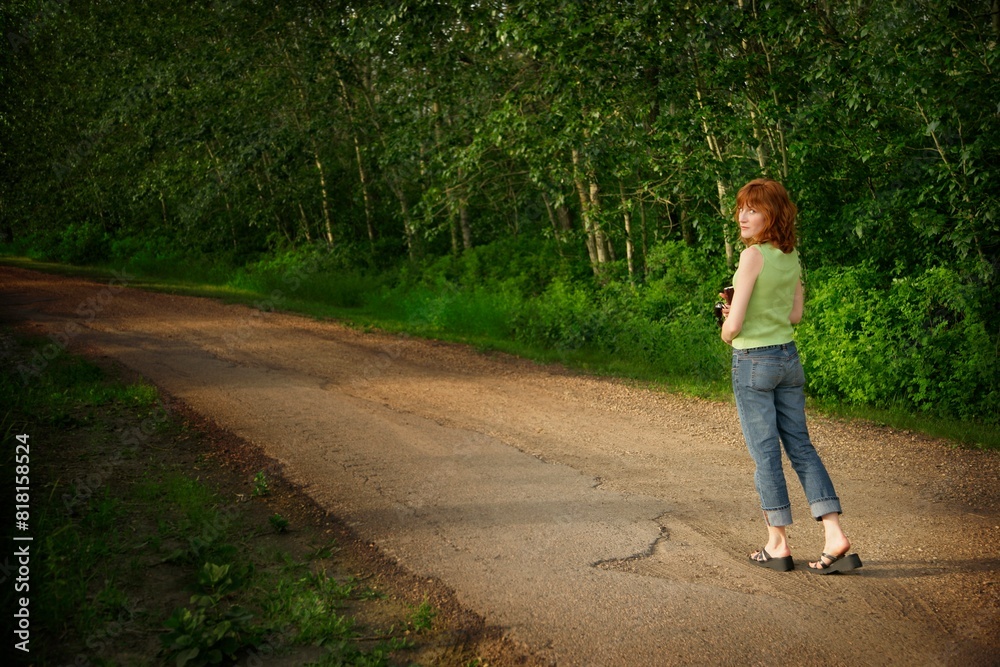 Woman Walking Down Pathway Woman Walking Down Pathway