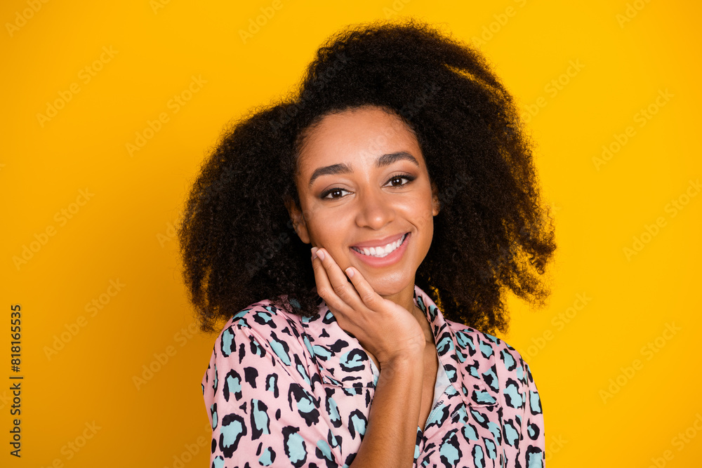 Photo portrait of attractive young woman touch soft skin cheek dressed stylish leopard print clothes isolated on yellow color background Photo portrait of attractive young woman touch soft skin cheek dressed stylish leopard print clothes isolated on yellow color background