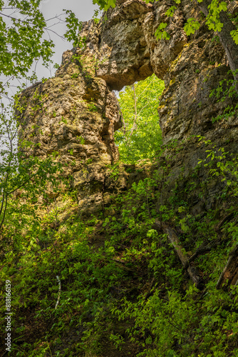 A Rock Arch Formation In The Woods During Spring