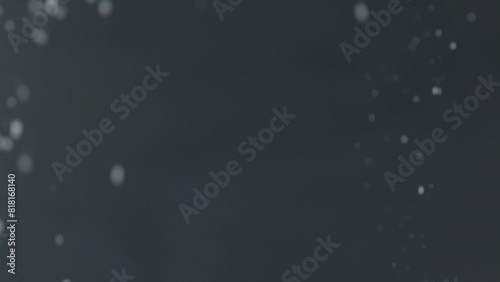 Sugar Powder Falling in front of Dark Background