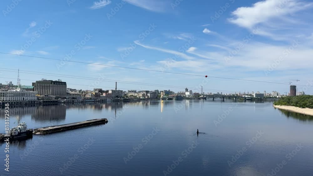 A barge floats along the Dnieper River in Kyiv, Ukraine A barge floats along the Dnieper River in Kyiv, Ukraine