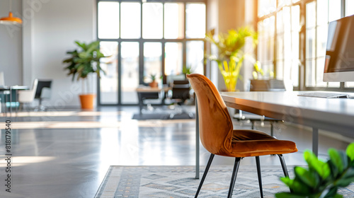 Stylish office featuring a cozy velvet chair  large windows  and ample natural light.