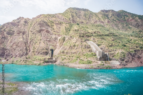 Nurek hydroelectric station in Tajikistan with an embankment dam and engineering structures and water discharge photo