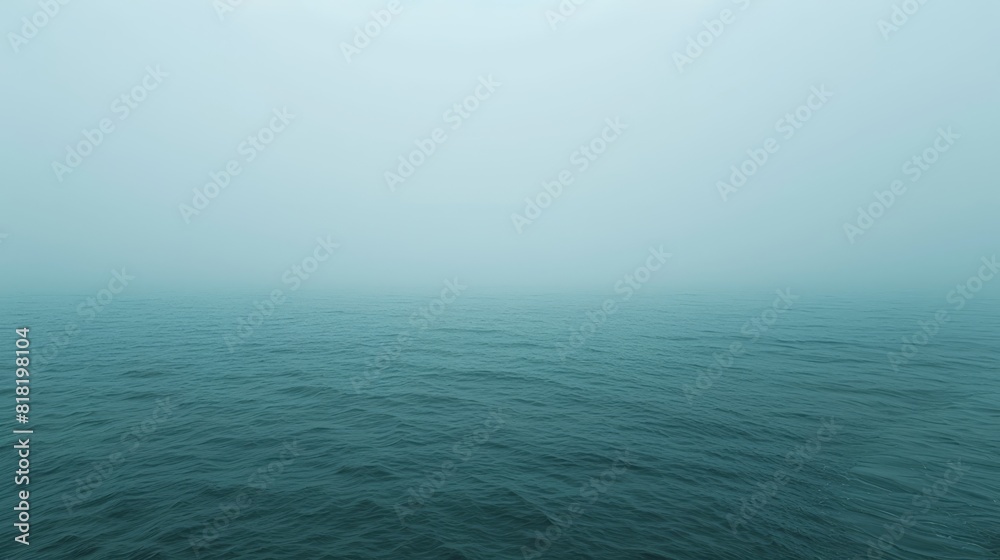 A large body of water heavily covered in fog and densely shrouded in smog A large body of water heavily covered in fog and densely shrouded in smog