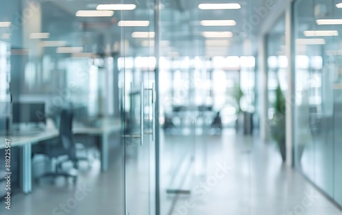 Blurred office interior background with blurred glass walls and white desks  blurred work environment in a modern building for a business concept
