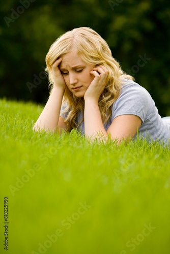 Young Girl Laying On Grass