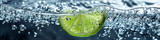 Refreshing Lime Slice Submerged in Sparkling Water with Bubbles