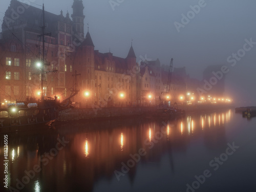 The old town of Gdańsk in the fog at night