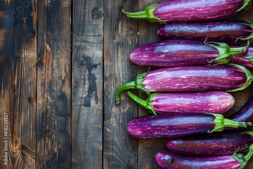 long purple eggplants on rustic wooden surface fresh organic vegetables still life