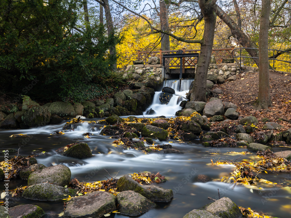 Waterfall in Oliwa Park in autumn, Baltic Coast