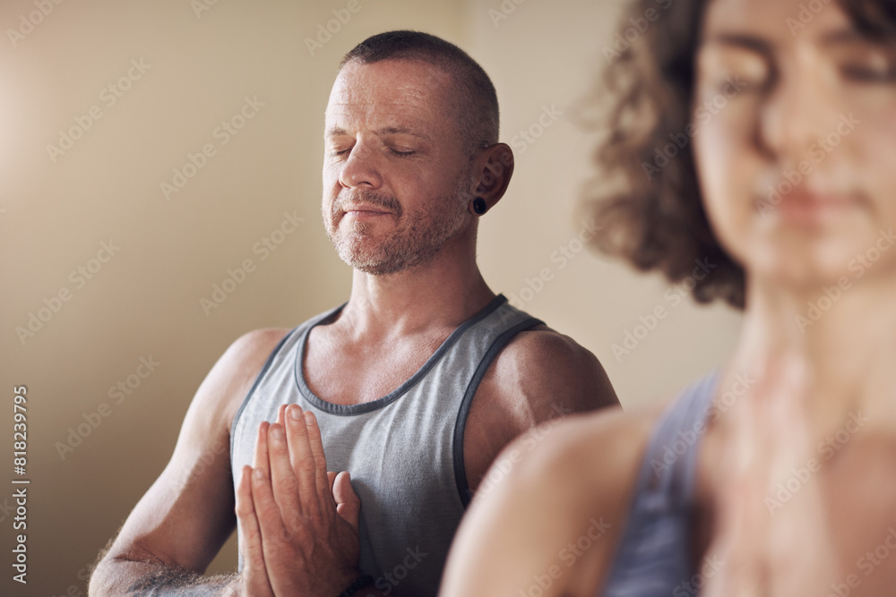 Man, prayer and hands for meditation with yoga for holistic wellness, mental health and healing in class. Guy, person and namaste for mindfulness, stress relief and zen with eyes closed and peaceful Man, prayer and hands for meditation with yoga for holistic wellness, mental health and healing in class. Guy, person and namaste for mindfulness, stress relief and zen with eyes closed and peaceful
