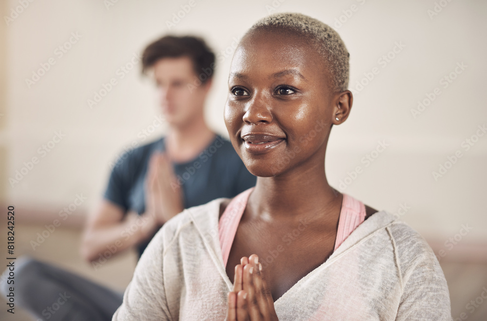 © peopleimages.com - Black woman, meditation and yoga in gym for relax, mindfulness and wellness. Female person, calm and zen indoor for health, balance and spiritual happiness with prayer and man in fitness studio