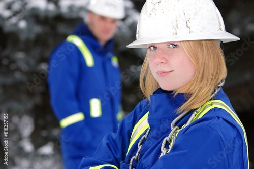 Tradeswoman With Tradesman Out Of Focus photo