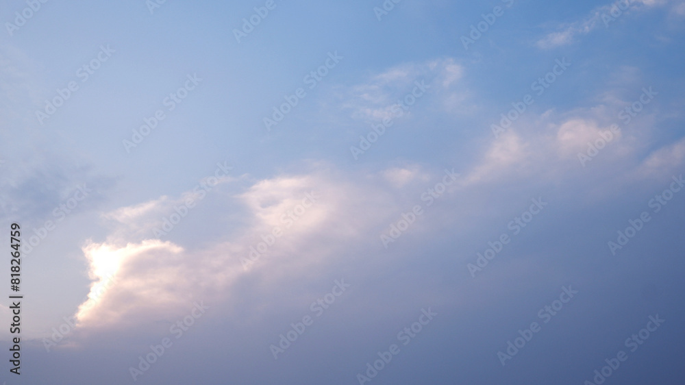 Sky background when a sunset behind the horizon. Background of white and blue sky gradient with copy space. Close-up sky and white clouds background for concept of a scene, nature view, and landscape.