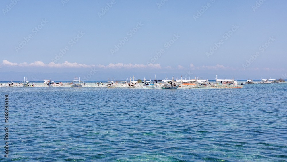 Phillipines tourists on the sand bar in paradise Phillipines tourists on the sand bar in paradise