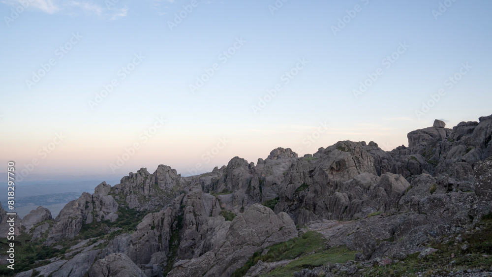 Fototapeta premium Panorama view of the rocky mountains under a magical sunset sky
