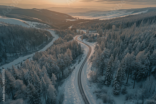 A snowy mountain road with trees in the background