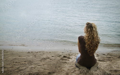 Woman Kneeling On Shore photo