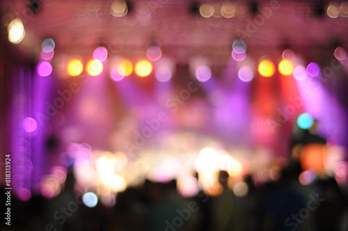 Defocused entertainment show lighting. Out of focus concert stage with bright spotlights with bokeh effect. Red light effect, Beautiful bokeh background