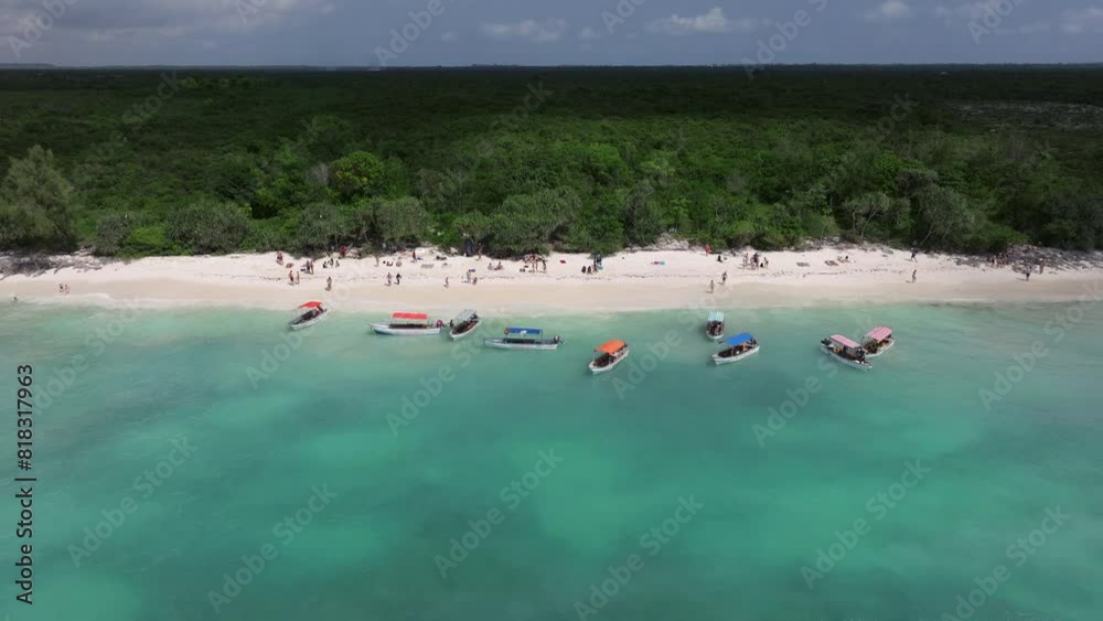 Panorama of Nemba beach with people and boat in the water.Scene reveals the splendid panorama background , summer concept, Tanzania, Zanzibar Panorama of Nemba beach with people and boat in the water.Scene reveals the splendid panorama background , summer concept, Tanzania, Zanzibar