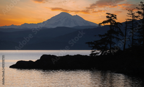 Abner Point on Lummi Island with Mt. Baker in the background. Seen from the Aiston Preserve with Smugglers Cove in the foreground and Bellingham Bay and the city of Bellingham in the distance.